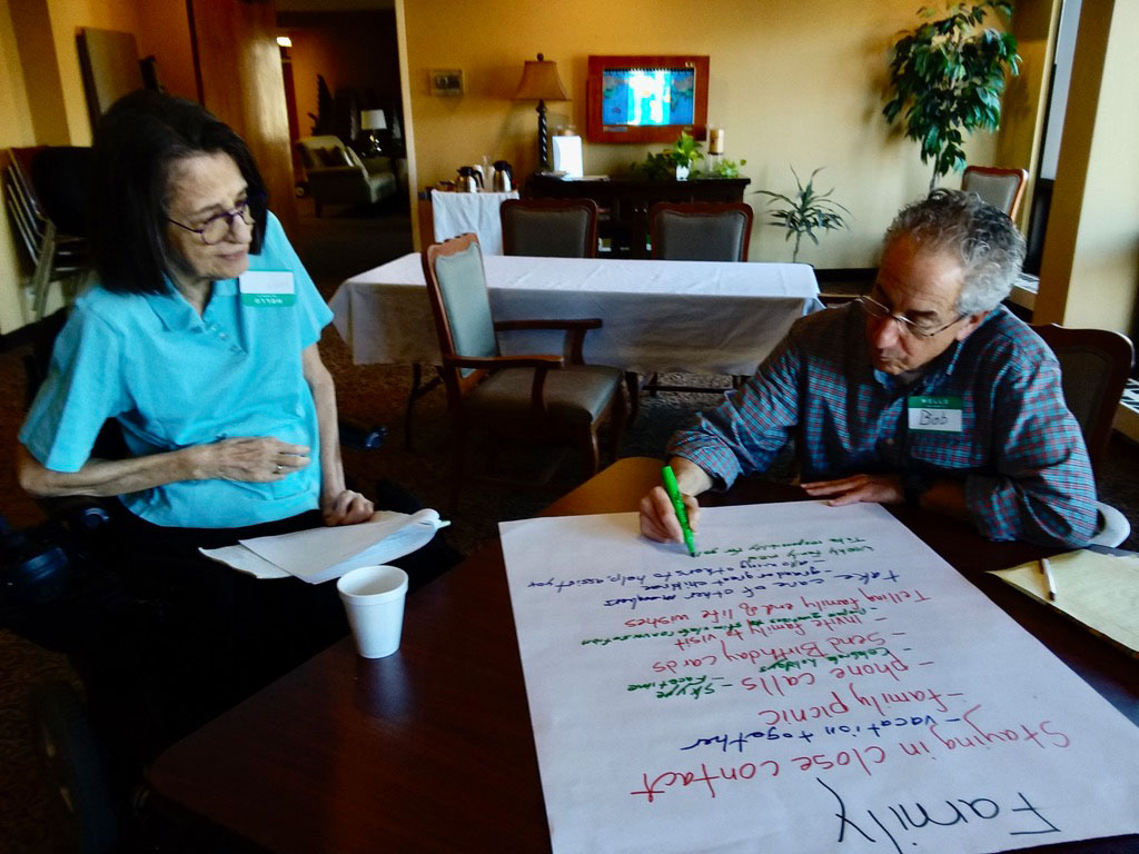 Nancy Eustis and Bob Held working together at an Aging with Gusto session