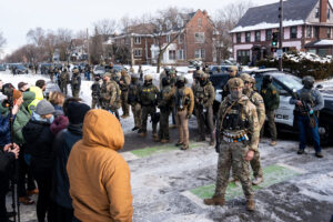 ICE agents and people standoff in Minneapolis. Credit Chad Davis with link to https://chaddavis.photography/sets/ice-in-minneapolis/