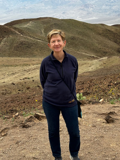 Veda Kanitz standing in front of landscape at Death Valley