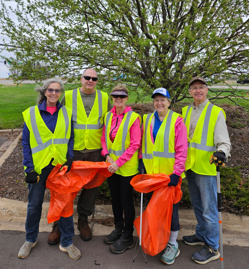 Wellness 50+ members dressed for cleaning up a Stillwater roadway.