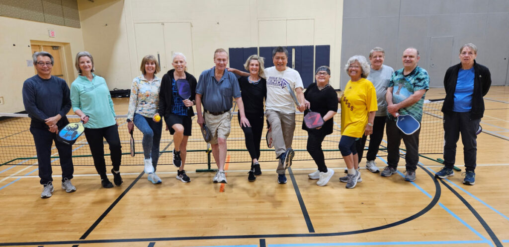 Wellness 50+ participants learning about pickleball.