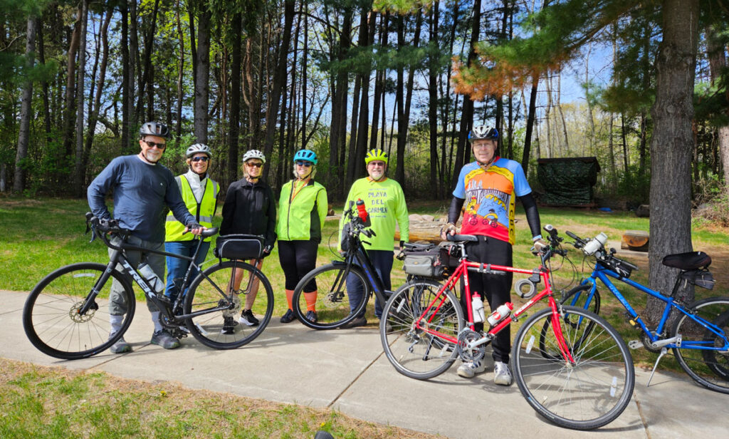 A group of bikers with their bikes getting ready for a ride.