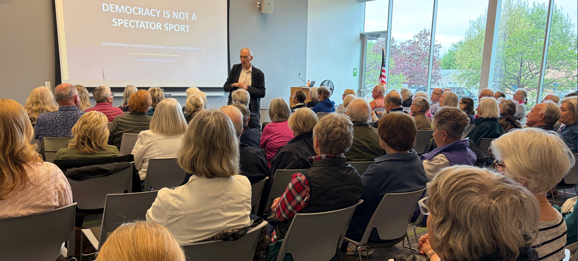 Professor David Schultz presenting a VAN Forum in front of a full crowd